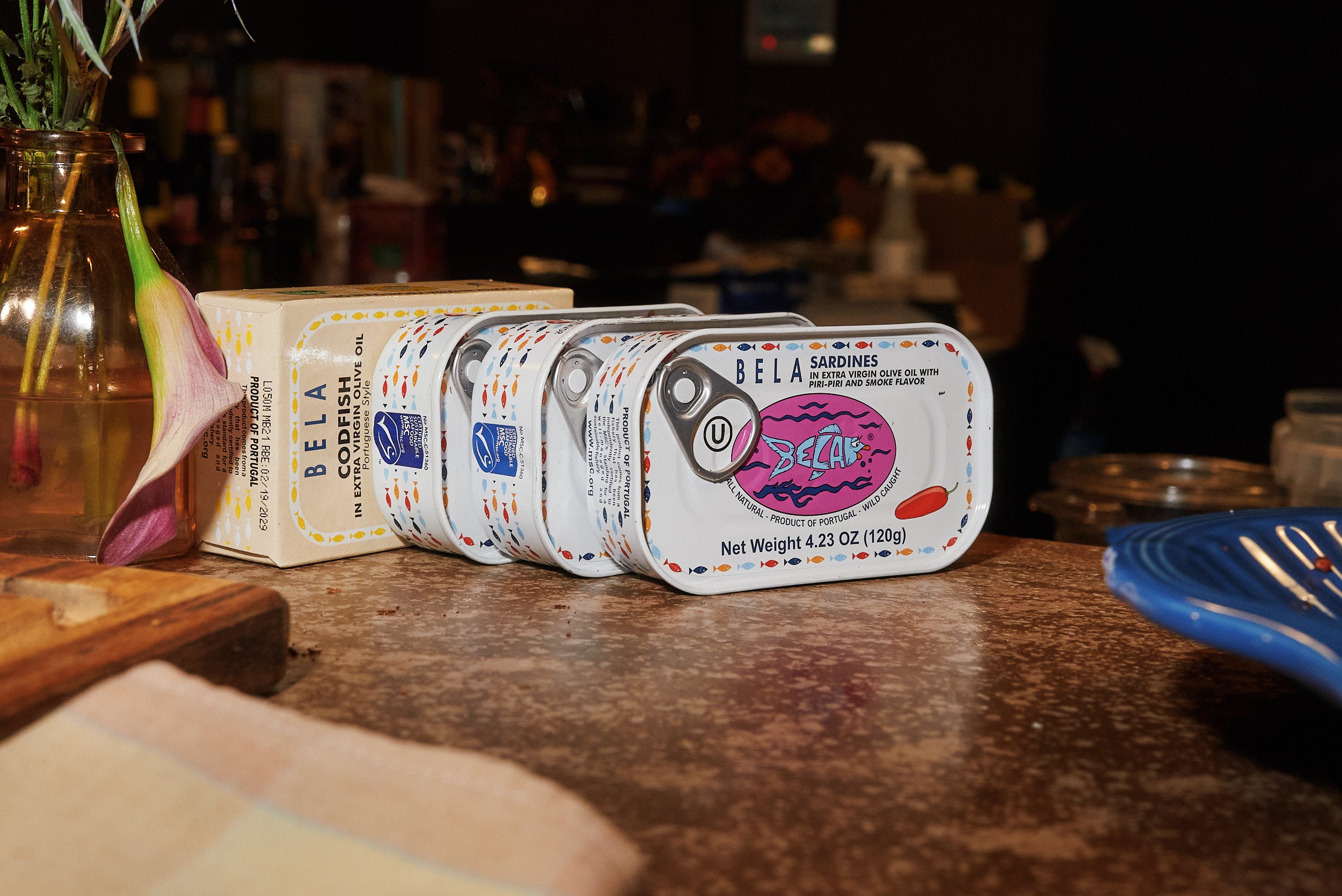 Various BELA tins placed in a row
