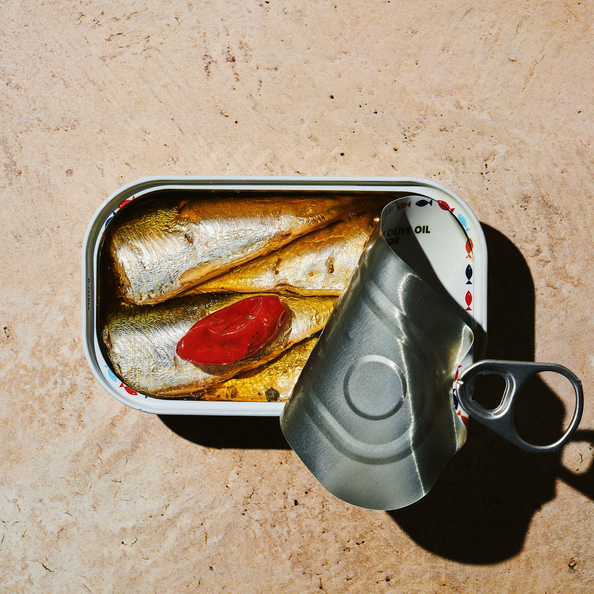 Open tin of BELA product