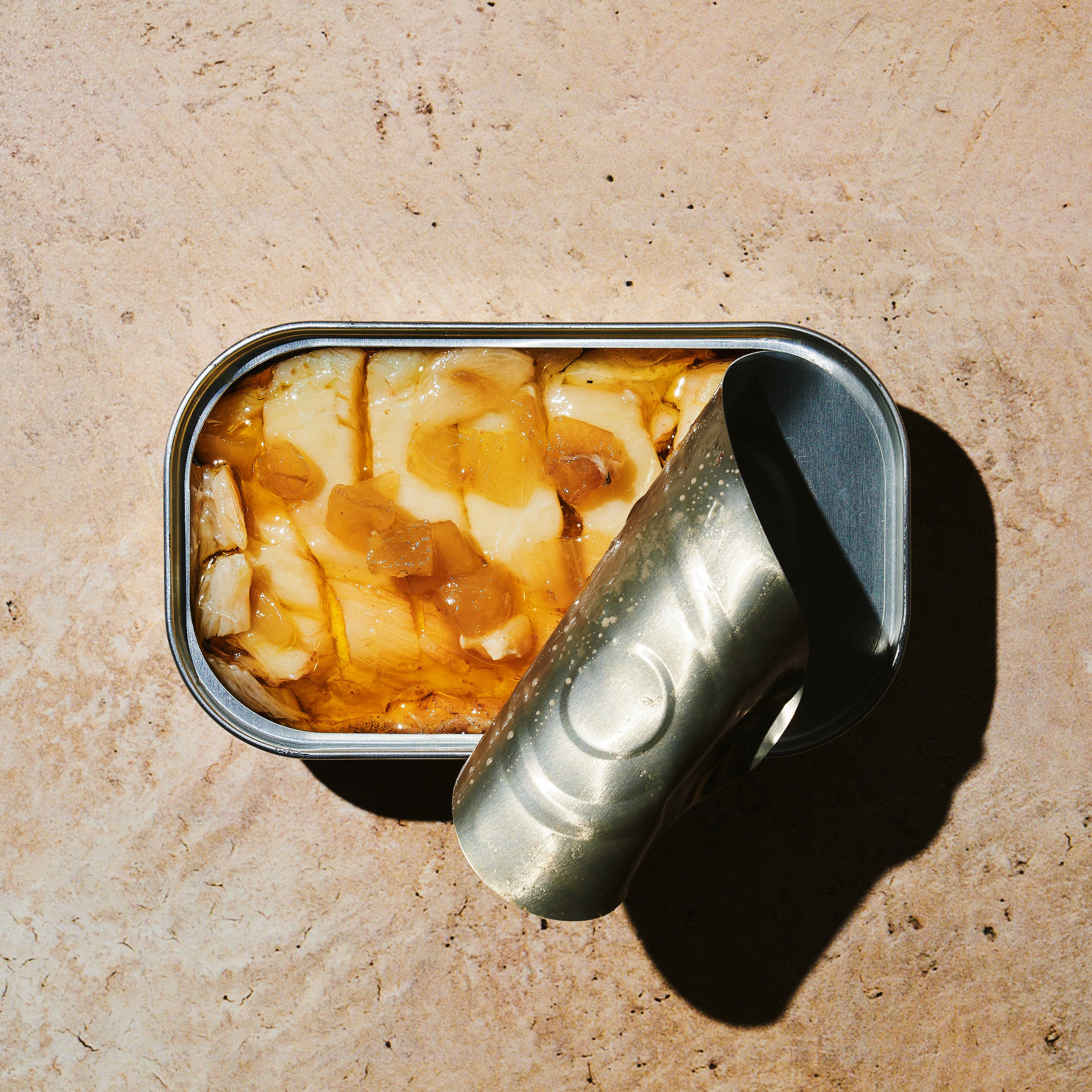 Open tin of BELA product